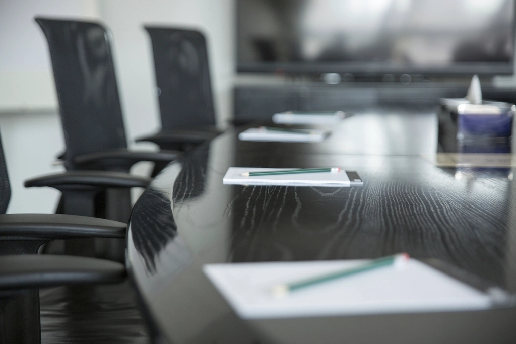 Chairs along a conference room table